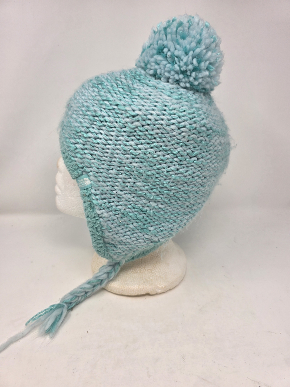 The North Face Womens Purrl Stitch Earflap Beanie Hat Aqua Blue Pom Fleece Lined